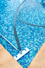 Swimming pool with cleaning tools in the bottom