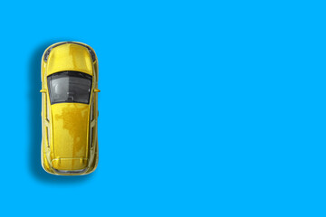Yellow taxi car on a blue background.