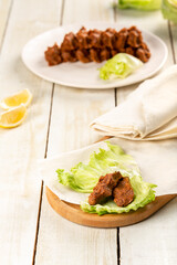 Raw meatballs or raw meatballs on a white wooden background. To close. local Turkish style raw meatballs