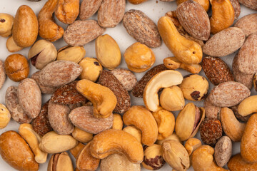 A group of almonds, pistachios, walnuts, macadamia, cashews.