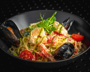 shrimp salad in a black bowl