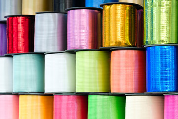 a set of coils  shiny ribbons in different colors for the label or decoration close-up as a texture background