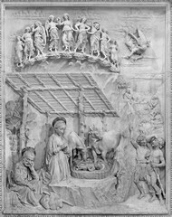 NAPLES, ITALY - APRIL 21, 2023: The marble relief of Nativity in the church Chiesa di Sant'Anna dei Lombardi by Antonio Rossellino ( 1475).