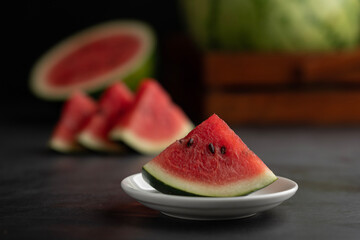 Watermelon slices in a plate, watermelon month concept image