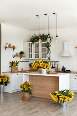 Modern Kitchen Interior with Island, Sink, Cabinets, and Sunflowers in New Luxury Home.