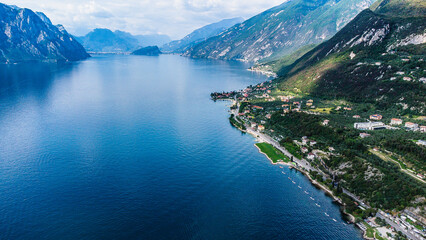 Fototapeta premium Lago Di Garda Italian drone aerial view. Mountains, lake nature view.