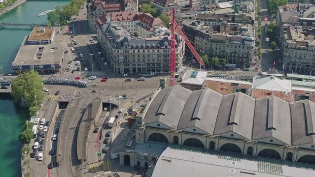 Aerial view with traffic, Station Square and Limmat River at Swiss City of Zürich on a hot and sunny summer day. Movie shot July 18th, 2023, Zurich, Switzerland.