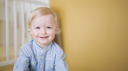 Portrait of cute happy child close-up of smiley face little kid 2 year old. Pretty little boy at home