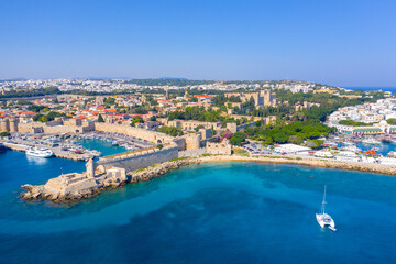 Fototapeta na wymiar Mandraki port with fort of St. Nicholas and windmills, Rhodes, Greece. 