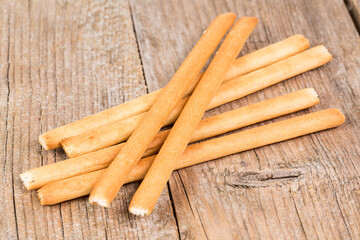bread sticks grissini on wooden background