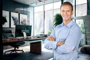 Naklejka na ściany i meble Portrait of smiling businessman in a corporate office