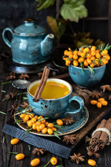 Sea buckthorn hot tea, autumn drinks concept