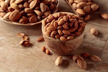 Almond nuts in a wooden bowl.