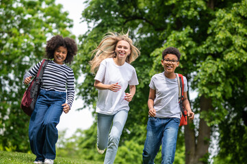 Group of young people feeling excited and happy in the park