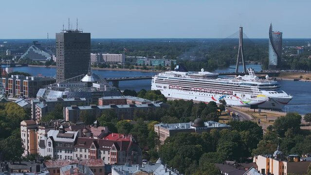 Huge cruise - Norwegian Dawn - ship docked in the center of Riga, Latvia. Aerial view of Riga city.
