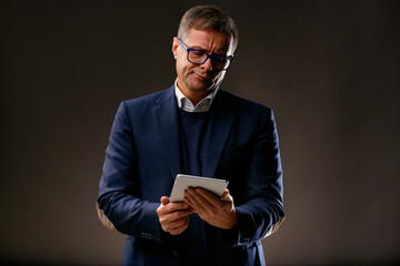 Middle-aged man reads disappointing news