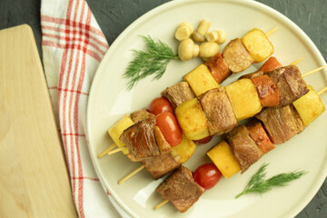 The meat is cooked on skewers over an open fire