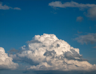 White and grey cumulus clouds background over the blue summer sky background