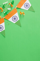 India Independence Day festive concept. Top view vertical composition of indian flag garlands,...