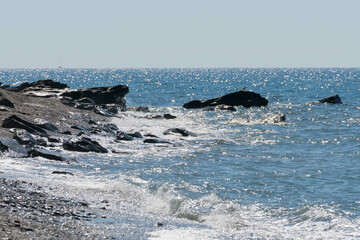 rocks on a beach in the mediterranean sea