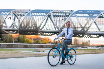 Business man riding a vintage bicycle in the city.