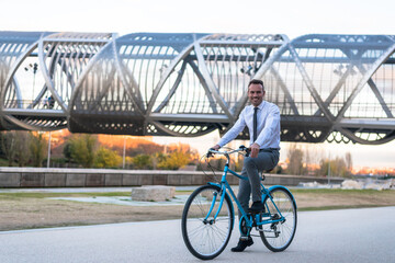 Business man riding a vintage bicycle in the city.