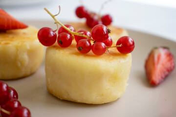Cheesecakes with berries on a plate