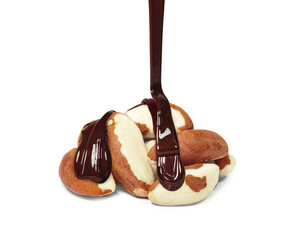 chocolate dripping on brazil nuts isolated on white