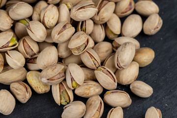 a large number of salty and crispy pistachios close-up