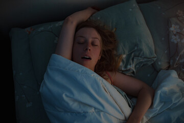 Young beautiful woman sleeping in bed at early morning - 624940148