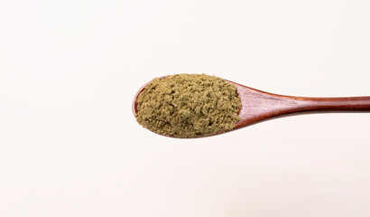 Top View Hemp Protein Powder On Wooden Spoon On Beige Background. Green Super Food, Healthy Lifestyle. Nutritional Supplement, Plant-based Protein. Horizontal Plane, Flat Lay Copy Space For Text.
