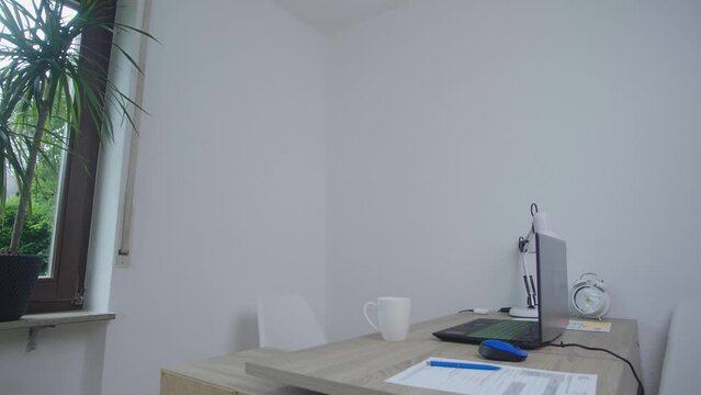 workplace of an office worker with a cup of tea on the table