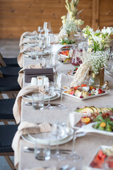 Beautiful wedding table decorations. Tablewear and bouquet of flowers.
