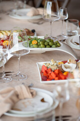 Beautiful wedding table decorations. Tablewear and bouquet of flowers.