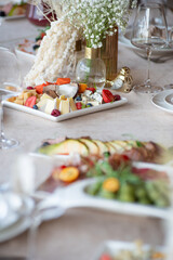 Beautiful wedding table decorations. Tablewear and bouquet of flowers.