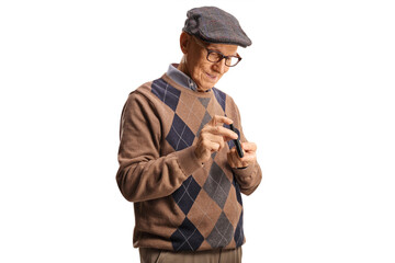 Elderly man poking finger with an insulin pen