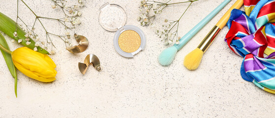 Composition with female accessories and flowers on light background with space for text