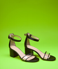 Chic open-toe women's shoes with block heels, clear vamps, ankle straps and beige insoles, isolated...