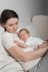 Fototapeta na wymiar Newborn with mom. 1 month baby with atopic dermatitis