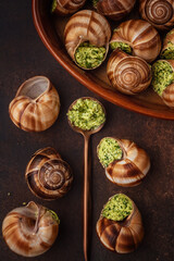 snails with aromatic oil and herbs. © Kate