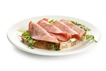 Tasty ham bruschetta with arugula on white background