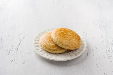 Sweet milk shortbreads on a light blue background. Traditional Russian homemade pastry
