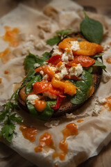 bruschetta with herbs, cheese and roasted peppers 