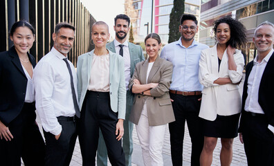 Team portrait multi-ethnic professionals smiling posing with confidence. Young and mature...