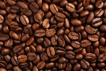 Fototapeta premium Fresh roasted coffee beans closeup pattern on dark background. Food pattern. Love coffee concept. Top view, flat lay with copy space