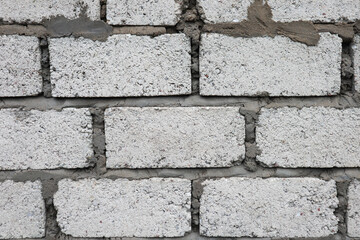 grey wall with open bricks concept 