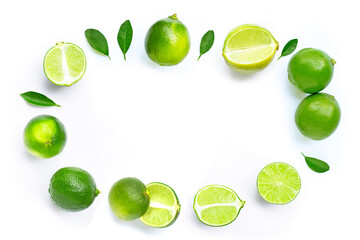 Composition with fresh ripe limes on white background.