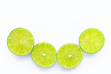 High vitamin C, Letter C made of limes with leaves isolated on white