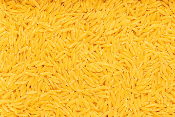 Macro blank photography of gurullos; pasta; macaroni; almerian, durum; wheat; semolina; raw; spanish; traditional; vegetarian
