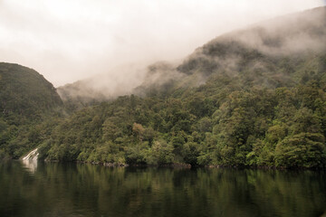 Sailing in  Mystical moody weather  in heavy rain and  stormy  conditions on Doubtful Sound